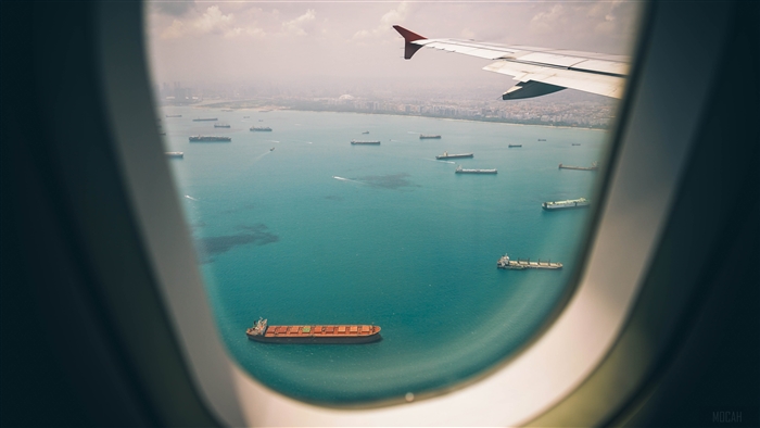 View of Ships at Sea from Airplane Window 4K