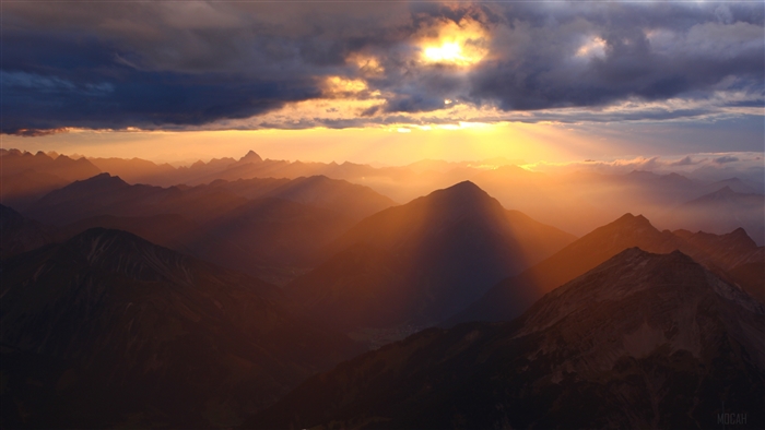Sun Rays Over Mountain Range 4K