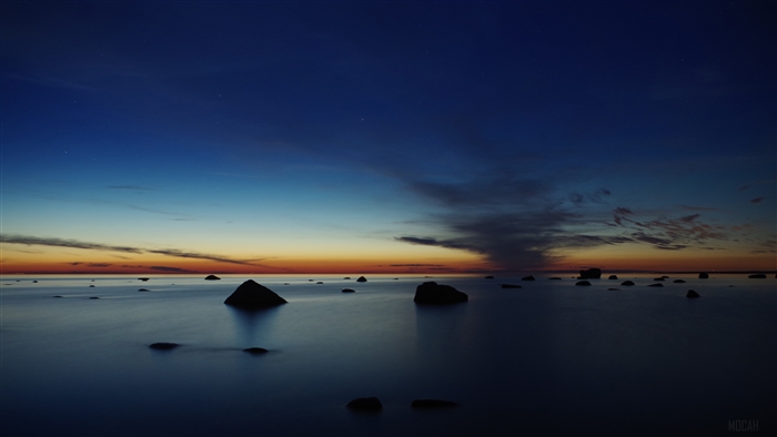 Rocks in the ocean at dusk