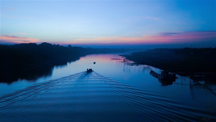 Boat on a river at dusk