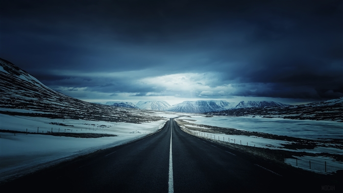 Empty Road Through Snowy Mountains Under Dark Sky 4k