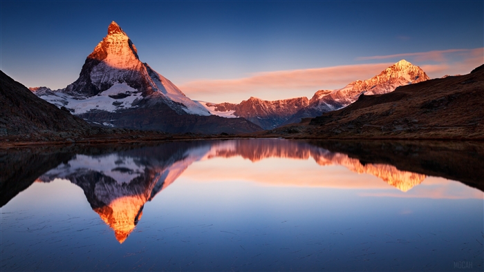 Matterhorn mountain reflected in lake at sunrise 4K
