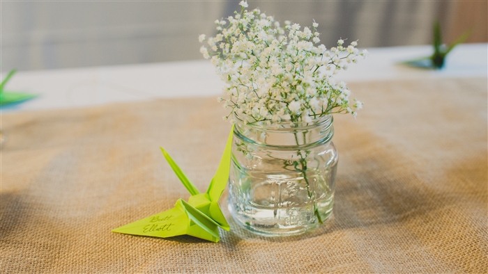 Origami crane with flowers in a jar