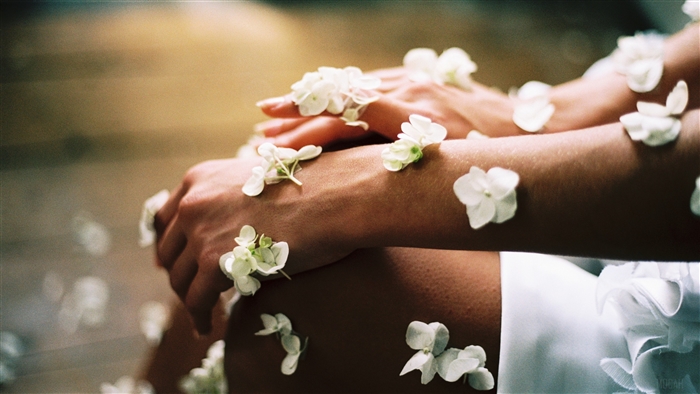 Hands with white flowers
