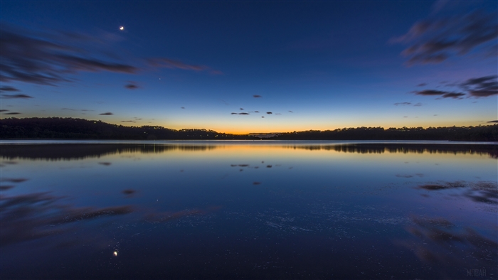 Narrabeen Lake at twilight with moon and stars