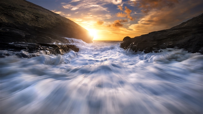 Ocean waves crashing on rocks at sunset 4K