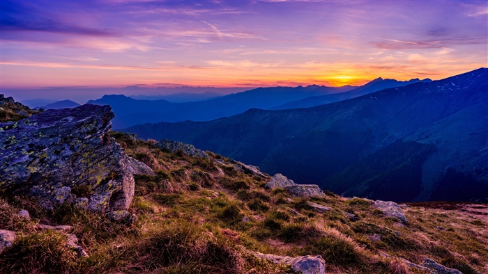 Mountains at sunset with purple and orange sky 4K
