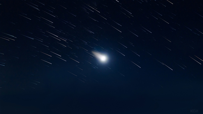 Star trails and a comet in the night sky