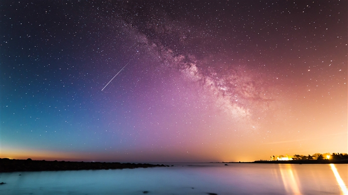Milky Way Galaxy and Shooting Star Over Ocean