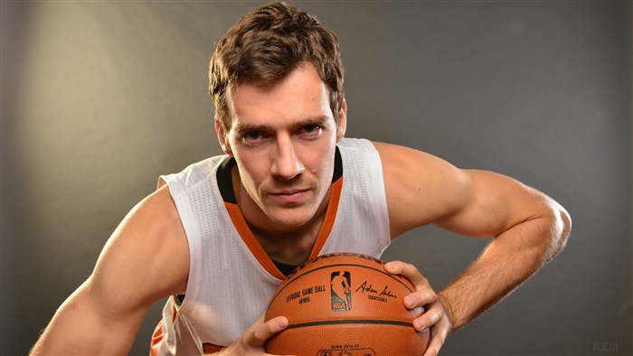 Goran Dragić of the Phoenix Suns holding an NBA basketball