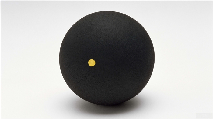 Black sphere with a gold dot