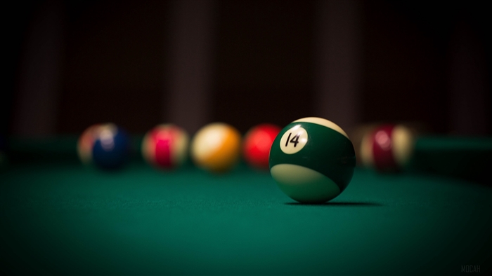Focused Billiards Ball Number 14 on Green Felt