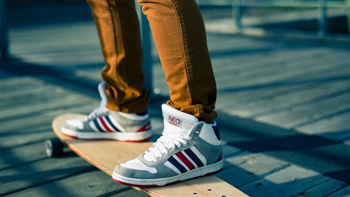 Person skateboarding in Adidas Neo sneakers 4K
