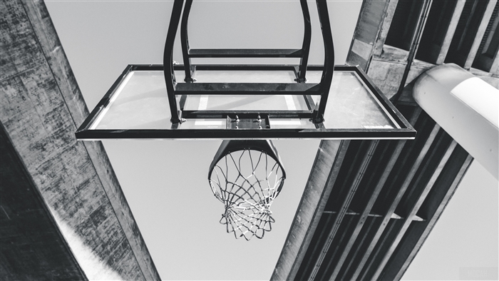 Basketball hoop and backboard under concrete structure, bw 4k