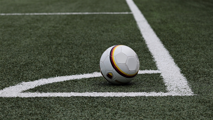 Soccer ball on a football field marking 4K