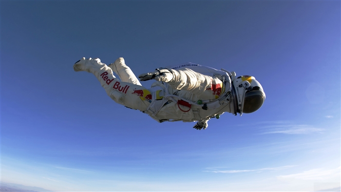 Felix Baumgartner in Red Bull Stratos suit skydiving
