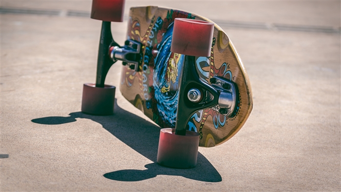 Skateboard with red wheels on concrete 4K