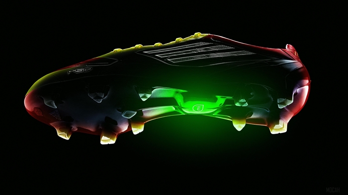 Adidas F50 football boot with green glow