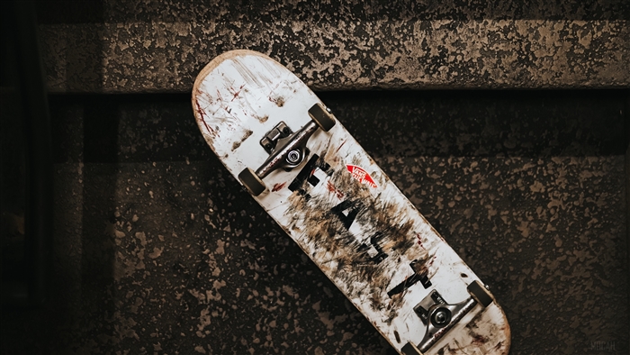 Dirty Skateboard with Vans Logo