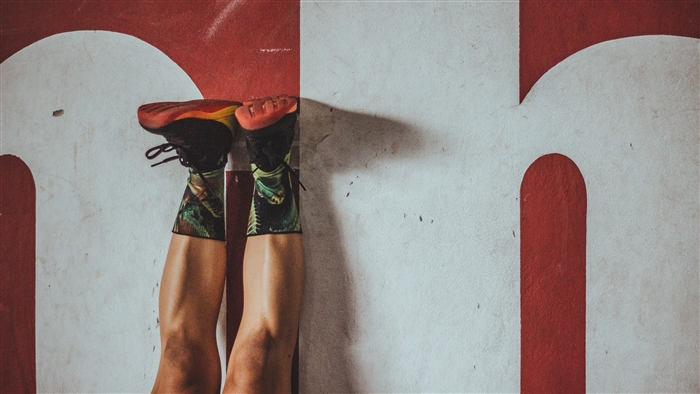 Person doing handstand on wall