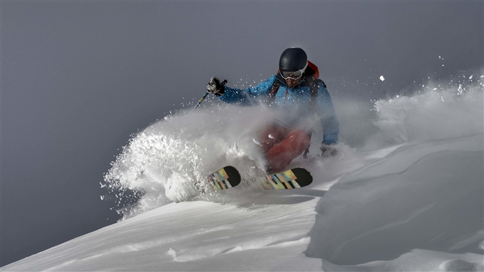 Skier skiing downhill in snow 4K