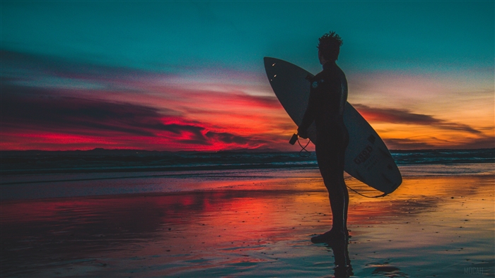 Surfer Standing on Shore at Sunset 4K