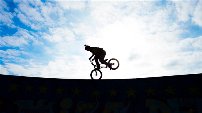 BMX biker silhouette against sky 4K