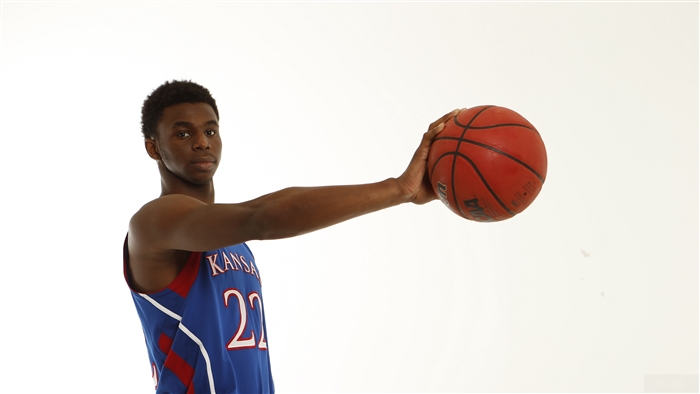 Andrew Wiggins holding a basketball