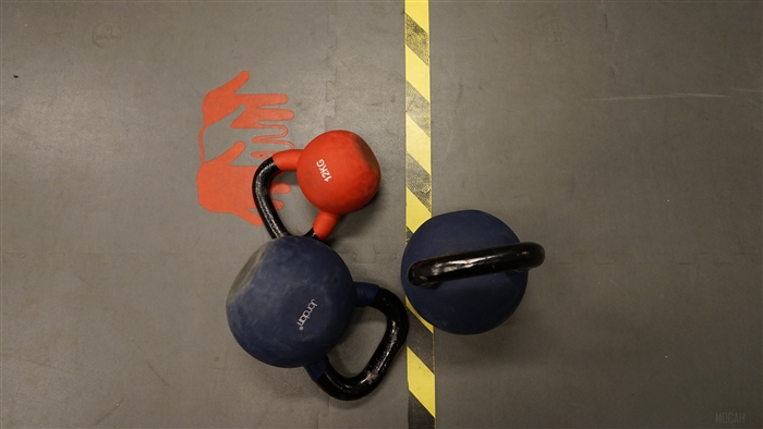 Kettlebells on Gym Floor with Hand Markings