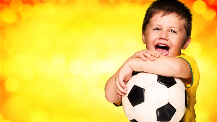 Young boy with a soccer ball, Brazil fan 4K