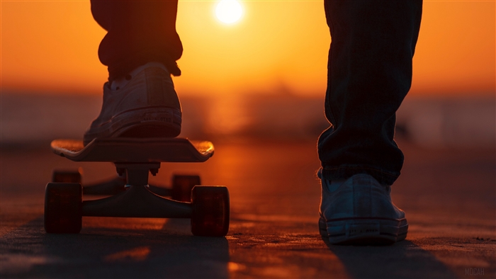 Person on skateboard at sunset 4K