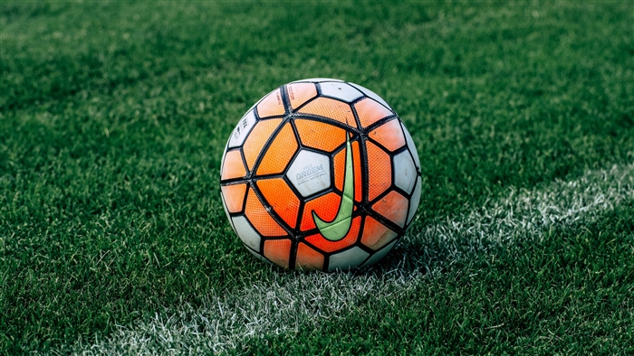 Vibrant Soccer Ball on Green Grass 4K