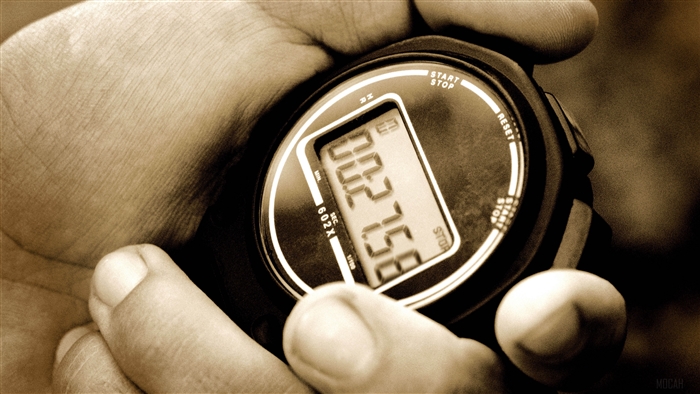 Close-up of a stopwatch in sepia tone