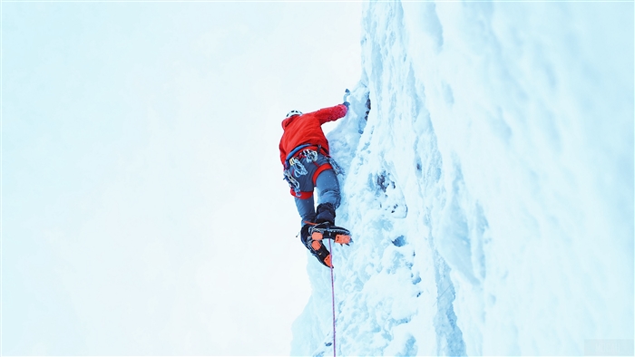 Ice climber in red jacket on snowy mountain 4K