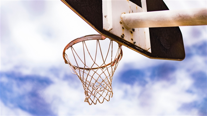 Basketball hoop and net against cloudy sky 4K
