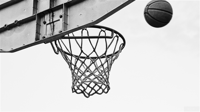 Basketball in mid-air near hoop