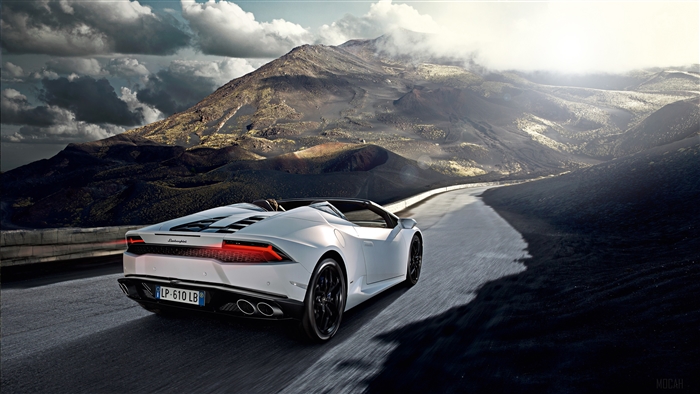 White Lamborghini Huracan driving on mountain road 4K