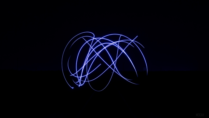 Blue light trails in a dark space