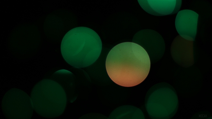Abstract green and orange bokeh circles 4K