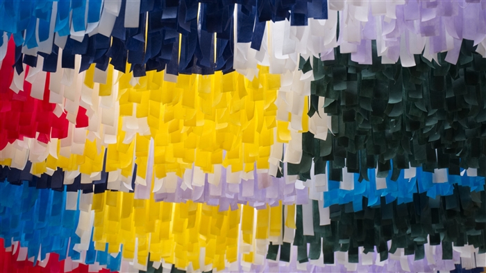 Colorful hanging paper streamers in multiple colors