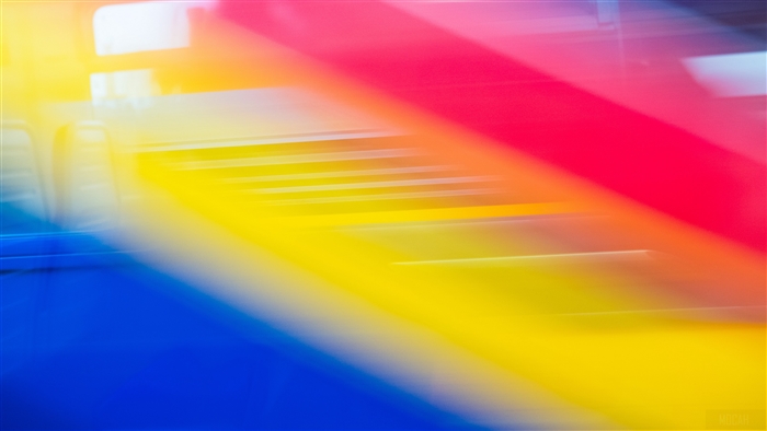 Abstract light streaks in blue, yellow, and red