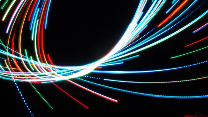 Multicolored neon light trails on black background 4K
