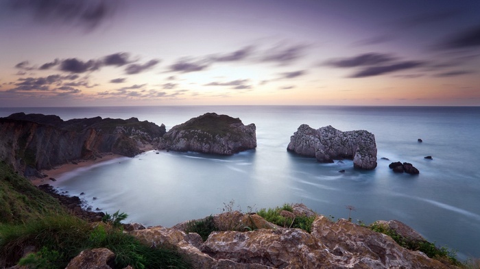 Rocky coastline with sea stacks at sunset