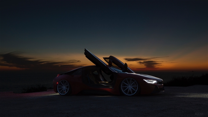Red Sports Car with Doors Open at Sunset