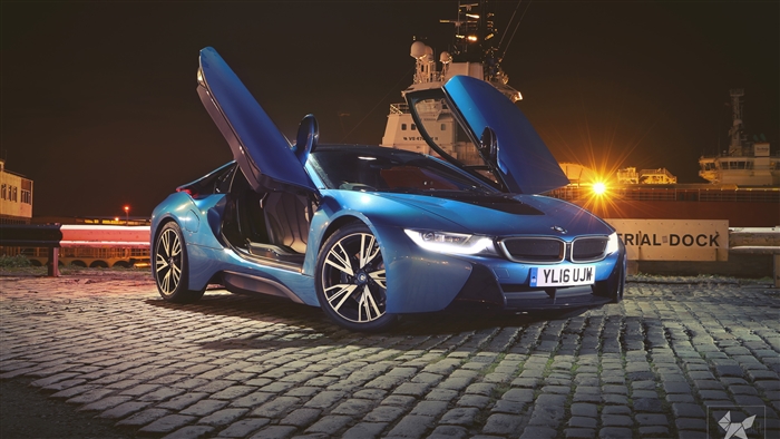 Blue BMW i8 with doors up at night