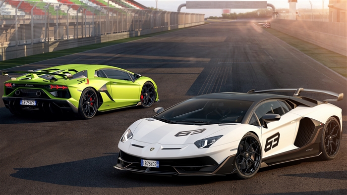 Two Lamborghini Aventador SVJ cars on a racetrack