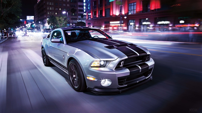 Silver Ford Shelby GT500 driving at night