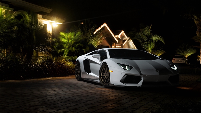 White Lamborghini Aventador parked at night