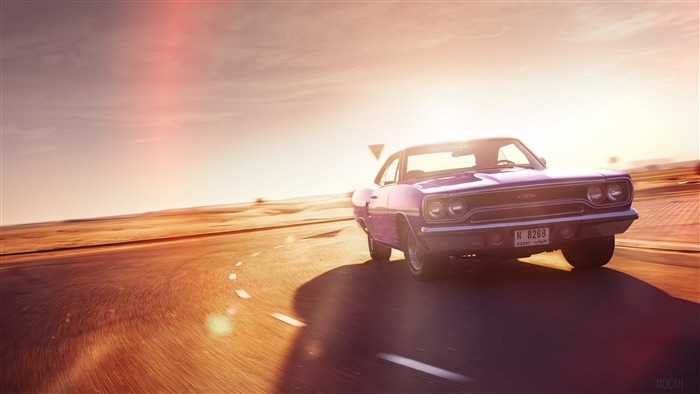 1970 Plymouth GTX driving on desert road