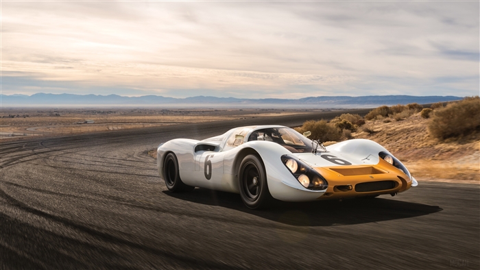 Porsche 908 race car on a desert road